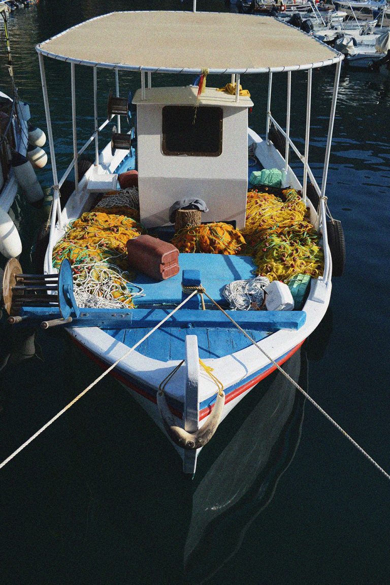 Fishing boat moored in the port of Paleokastritsa. Corfu, Greece